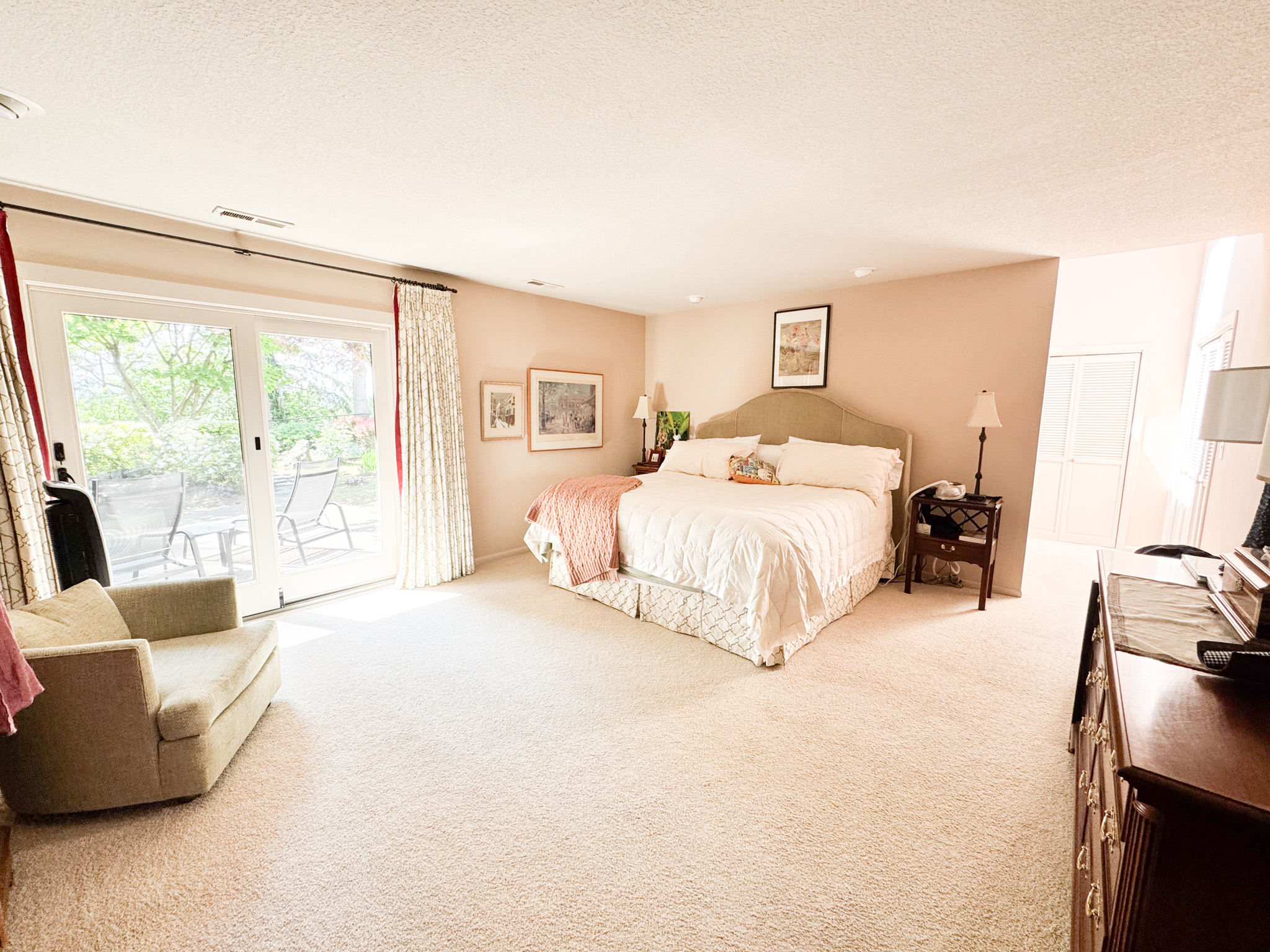 Primary bedroom suite with patio access